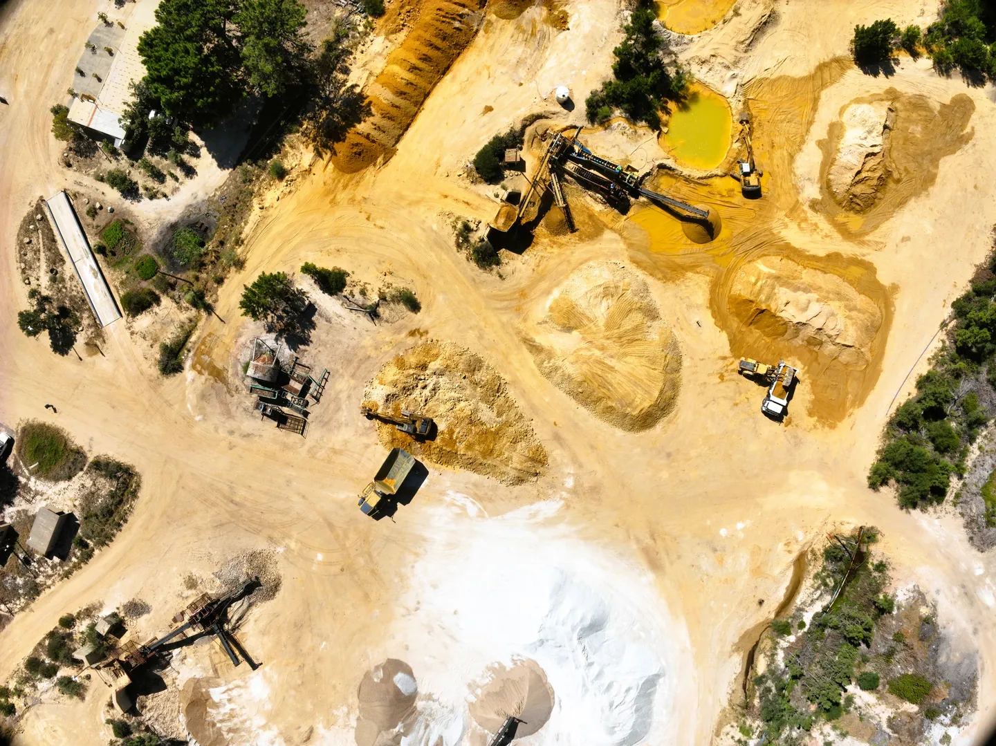 Aerial view of sand mining site with machinery