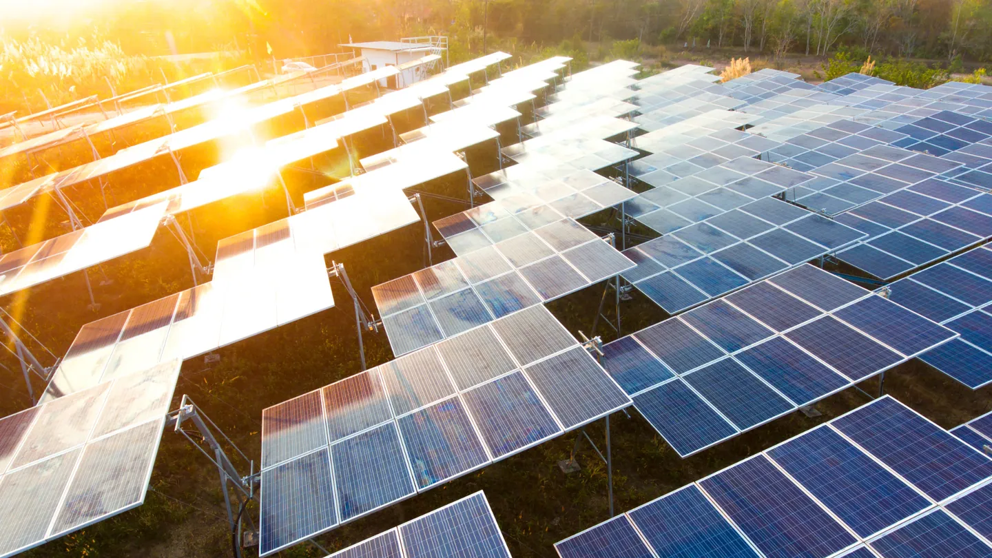 Solar panels generating renewable energy at sunrise